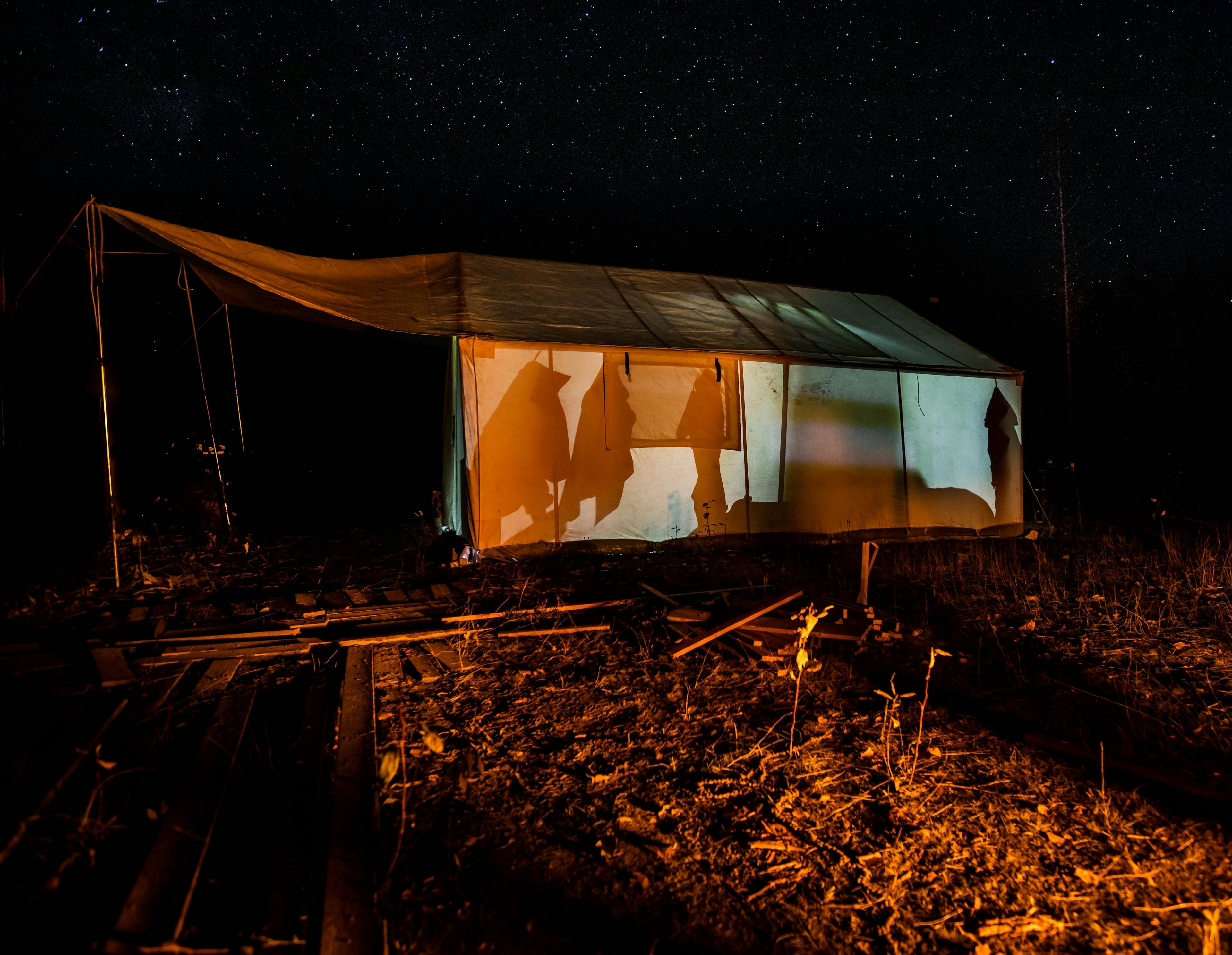 A tent at night time